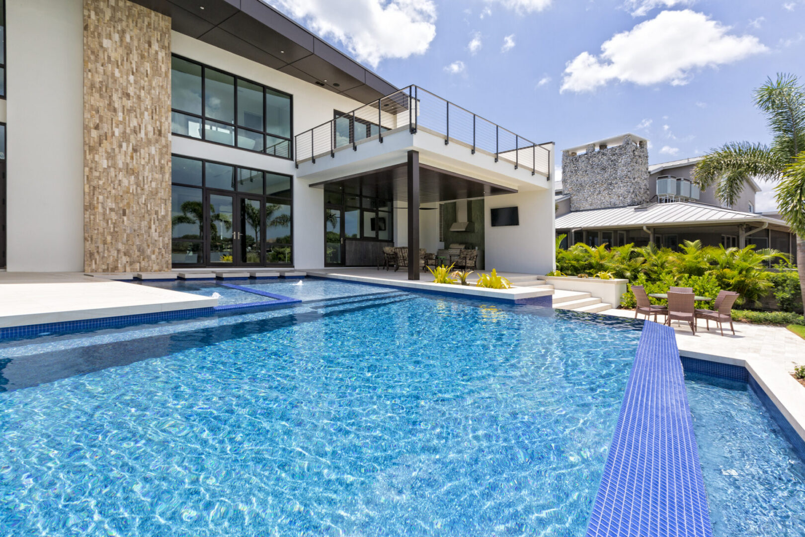 Modern architecture with blue tiled pool